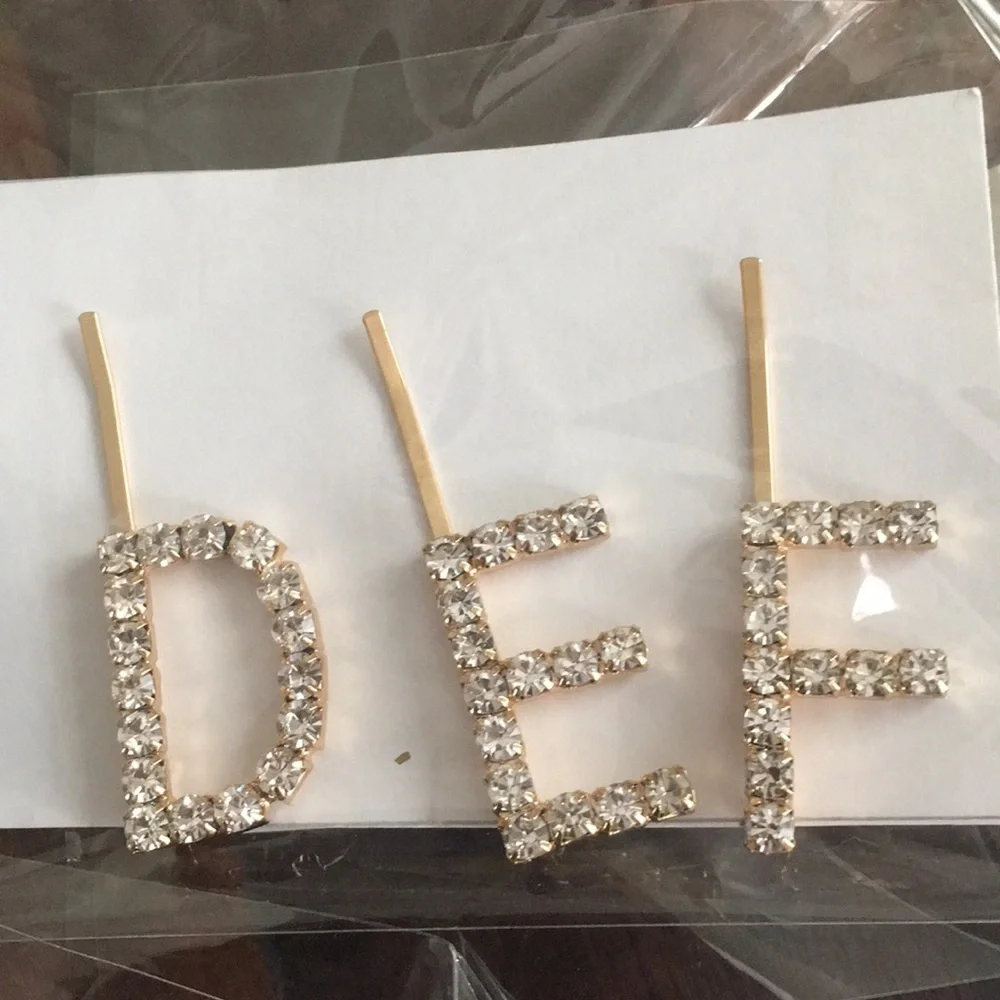 Anthropologie rhinestone initial barrettes.‎ Great!